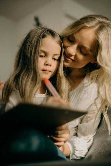 Photo of mother and daughter working together