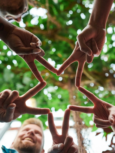 Photo of fingers together shaping a star